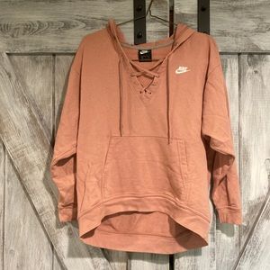 Light pink colored Nike hoodie sweater